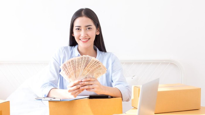 Young Asian Woman Working at home, Young Owner Woman Start up for Business Online. People with online shopping SME entrepreneur or freelance working concept.