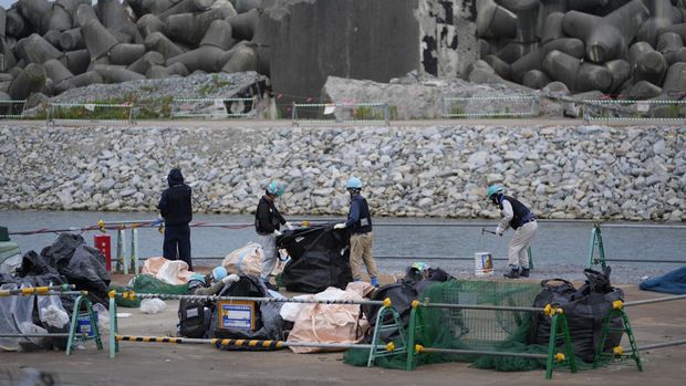 People work at the Fukushima Daiichi nuclear power plant, operated by Tokyo Electric Power Company Holdings, also known as TEPCO, in Futaba town, northeastern Japan, Friday, July 14, 2023. (AP Photo/Hiro Komae)