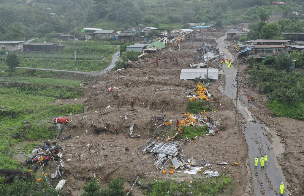 Houses collapsed from a landslide caused by heavy rain are seen in Yecheon, South Korea, Saturday, July 15, 2023. Two days of heavy rain in South Korea killed several people and left a few others missing in landslides and floods, the government said Saturday. (Yun Kwan-shick/Yonhap via AP)
