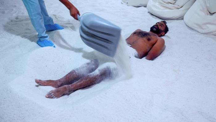 Ali Hamad Abdelmenem, a salt cave visitor, receives an anti-stress treatment at the facility in Al Ain, United Arab Emirates, July 11, 2023. Imported from Cracow, city in Poland, the salt is rich in negative ions and minerals such as sodium and magnesium and is presented as a remedy for health and skin conditions at the 171-square metre grotto. REUTERS/Rula Rouhana