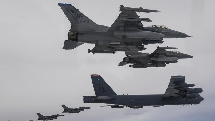 In this photo provided by South Korean Defense Ministry, a U.S. B-52H bomber, center, and F-16 fighter jets and South Korean Air Force F-15K fighter jets, left and right, fly over the Korean Peninsula during a joint air drill in South Korea, Thursday, July 13, 2023. North Korean leader Kim Jong Un vowed to further bolster his country's nuclear fighting capabilities as he supervised the second test flight of a new, powerful intercontinental ballistic missile designed to strike the mainland United States, state media reported Thursday. (South Korea Defense Ministry via AP)