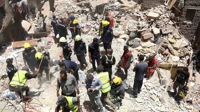 Rescuers search through the rubble of a collapsed five-story apartment building in Cairo, Egypt, Monday, July 17, 2023. A five-story apartment building collapsed Monday in the Egyptian capital of Cairo, leaving several people dead, authorities said, as rescuers at the scene searched through the rubble. Building collapses are common in Egypt, where shoddy construction and a lack of maintenance are widespread in shantytowns, poor city neighborhoods and rural areas. (AP Photo)