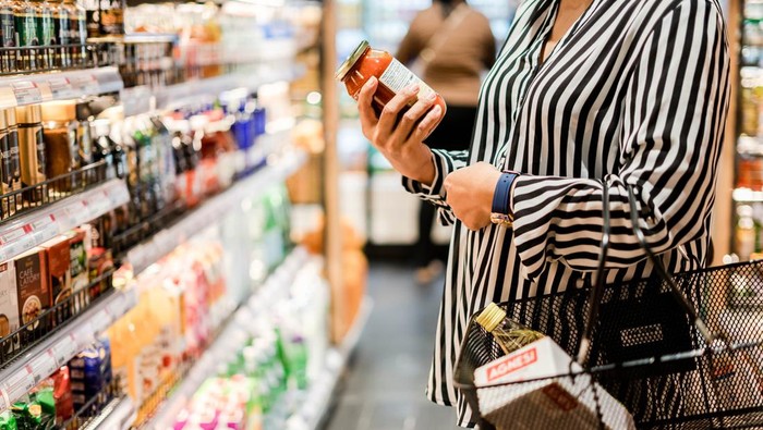 Bangkok, THAILAND - August 5, 2019: Woman chooses products in the supermarket, Ready-made food, Shopping .