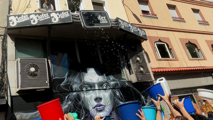 Revellers cheer on as a float inaugurates the annual 