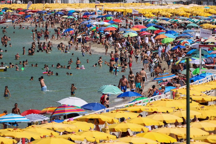 People cool off at Mondello beach, during a heatwave across Italy, in Palermo, Italy, July 15, 2023. REUTERS/Igor Petyx