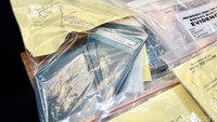 Polisi juga menyita sejumlah barang bukti salah satunya paspor. 