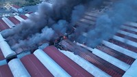 Militer Rusia mengatakan telah menyerang fasilitas militer Ukraina di dekat pelabuhan Odesa, Rabu (19/7/2023). Ukraina menuduh Rusia menargetkan fasilitas yang digunakan untuk menampung biji-bijian yang akan diekspor Ukraina. State Emergency Service of Ukraine/Handout/REUTERS