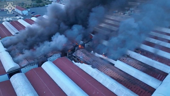 Smoke billows from a fire at a site of storage facilities hit during Russian missile and drone strikes, amid Russias attack on Ukraine, in Odesa, Ukraine July 19, 2023, in this still image obtained from a handout video.  State Emergency Service of Ukraine in the Odesa region via Facebook/Handout via REUTERS ATTENTION EDITORS - THIS IMAGE HAS BEEN SUPPLIED BY A THIRD PARTY. MANDATORY CREDIT. DO NOT OBSCURE LOGO.