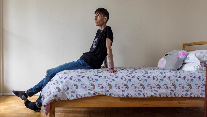 Lisa Pauli, 47, who says she wants to apply for medical assistance in dying (MAiD) when she is eligible because of her severe anorexia, sits on a bed, in Toronto, Ontario, Canada June 9, 2023.  REUTERS/Carlos Osorio
