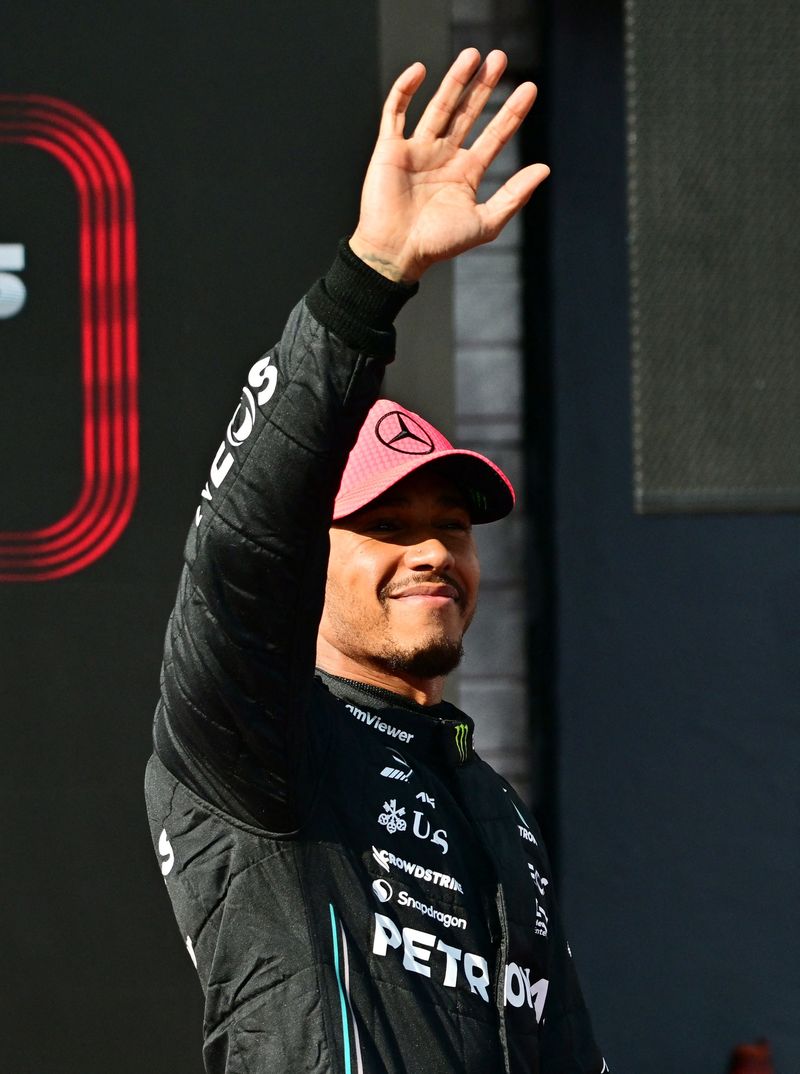 Formula One F1 - Hungarian Grand Prix - Hungaroring, Budapest, Hungary - July 22, 2023 Mercedes' Lewis Hamilton waves to fans after finishing in pole position in qualifying REUTERS/Marton Monus