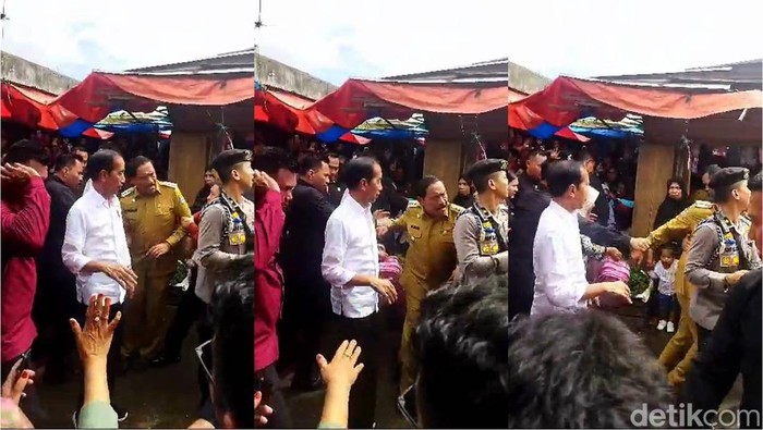 Momen Bupati Bengkulu Utara Mian ditarik seseorang di dekat Presiden Joko Widodo.