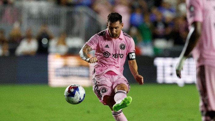 Jul 21, 2023; Fort Lauderdale, FL, USA; Inter Miami CF forward Lionel Messi (10) scores a goal past Cruz Azul goalkeeper Andres Gudiño (30) during the second half at DRV PNK Stadium. Mandatory Credit: Nathan Ray Seebeck-USA TODAY Sports