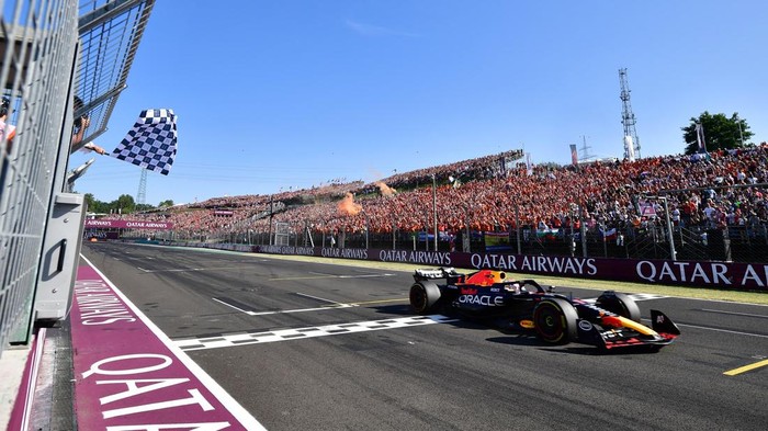 Formula One F1 - Hungarian Grand Prix - Hungaroring, Budapest, Hungary - July 23, 2023 Red Bulls Max Verstappen passes the chequered flag to win the Hungarian Grand Prix REUTERS/Marton Monus/Pool