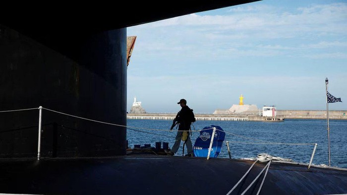 A crew patrols on the deck of U.S. Ballistic Missile Submarine USS Kentucky anchored at Busan Naval Base, in Busan, South Korea, July 19, 2023. WOOHAE CHO/Pool via REUTERS