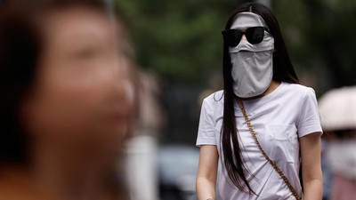 Facekinis Jadi Tren Baru Warga China Gegara Panas Menggila