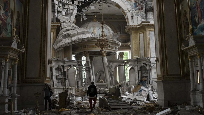 Church personnel inspect damages inside the Odesa Transfiguration Cathedral in Odesa, Ukraine, Sunday, July 23, 2023, following Russian missile attacks. (AP Photo/Jae C. Hong)
