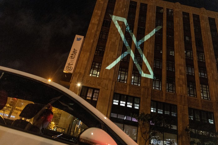 Twitters new logo is seen projected on the corporate headquarters building in downtown San Francisco, California, U.S. July 23, 2023. REUTERS/Carlos Barria