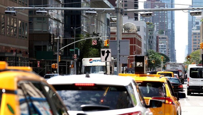 A newly installed set of tolling mechanisms hang over West End Avenue at 61st Street in Manhattan, ahead of New York City’s planned congestion pricing program to charge drivers for entering the central business district as early as next year, in New York, U.S., July 21, 2023. REUTERS/Mike Segar