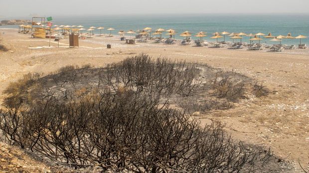 A destroyed beach bar at the beach of Glystra, as a wildfire burns on the island of Rhodes, Greece, July 24, 2023. REUTERS/Nicolas Economou