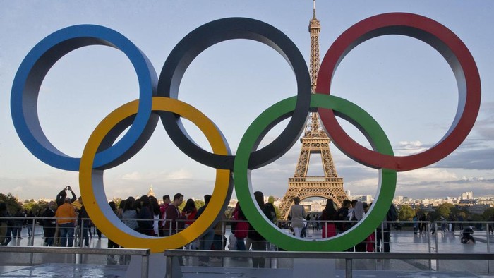 FILE - The Olympic rings are set up at Trocadero plaza that overlooks the Eiffel Tower, a day after the official announcement that the 2024 Summer Olympic Games will be in the French capital, in Paris, Thursday, Sept. 14, 2017.  (AP Photo//Michel Euler, File)