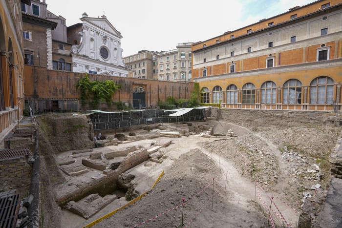 People walk in the excavation site of the ancient Roman emperor Neros theater, 1st century AD, during a press preview, in Rome, Wednesday, July 26, 2023. The ruins of Neros Theater, an imperial theater referred to ancient Roman texts but never found, have been discovered under the garden of the future Four Seasons Hotel, steps from the Vatican, after excavating the walled garden of the Palazzo della Rovere since 2020, as part of planned renovations on the Renaissance building. (AP Photo/Andrew Medichini)