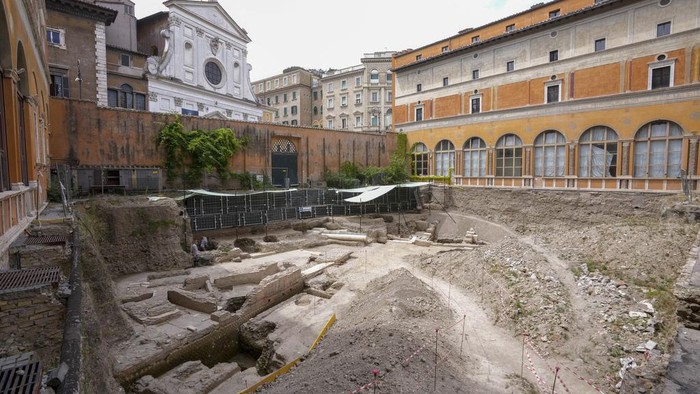 People walk in the excavation site of the ancient Roman emperor Nero's theater, 1st century AD, during a press preview, in Rome, Wednesday, July 26, 2023. The ruins of Nero's Theater, an imperial theater referred to ancient Roman texts but never found, have been discovered under the garden of the future Four Season's Hotel, steps from the Vatican, after excavating the walled garden of the Palazzo della Rovere since 2020, as part of planned renovations on the Renaissance building. (AP Photo/Andrew Medichini)