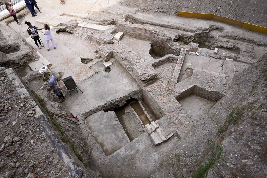 People walk in the excavation site of the ancient Roman emperor Nero's theater, 1st century AD, during a press preview, in Rome, Wednesday, July 26, 2023. The ruins of Nero's Theater, an imperial theater referred to ancient Roman texts but never found, have been discovered under the garden of the future Four Season's Hotel, steps from the Vatican, after excavating the walled garden of the Palazzo della Rovere since 2020, as part of planned renovations on the Renaissance building. (AP Photo/Andrew Medichini)