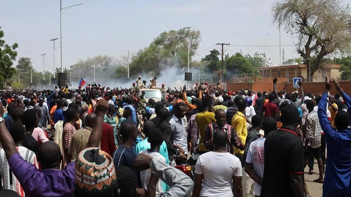 Security forces launch tear gas to disperse pro-junta demonstrators gathered outside the French embassy, in Niamey, the capital city of Niger, on Sunday. (Stringer/Reuters)