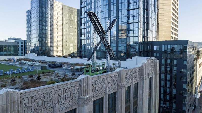 An “X” sign rests atop the company headquarters, formerly known as Twitter, in downtown San Francisco, on Friday, July 28, 2023. The city has launched an investigation into the sign as city officials say replacing letters or symbols on buildings, or erecting a sign on top of one, requires a permit. (AP Photo/Noah Berger)