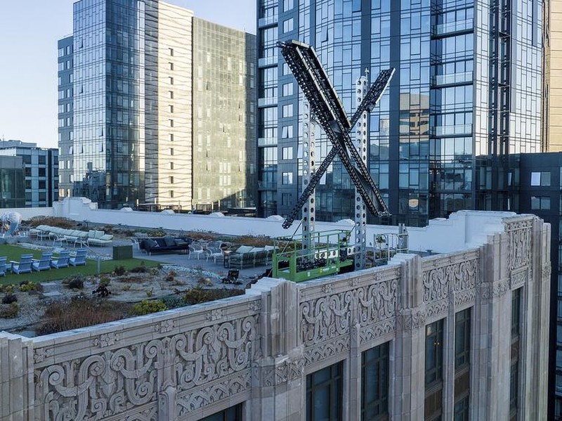 An “X” sign rests atop the company headquarters, formerly known as Twitter, in downtown San Francisco, on Friday, July 28, 2023. The city has launched an investigation into the sign as city officials say replacing letters or symbols on buildings, or erecting a sign on top of one, requires a permit. (AP Photo/Noah Berger)