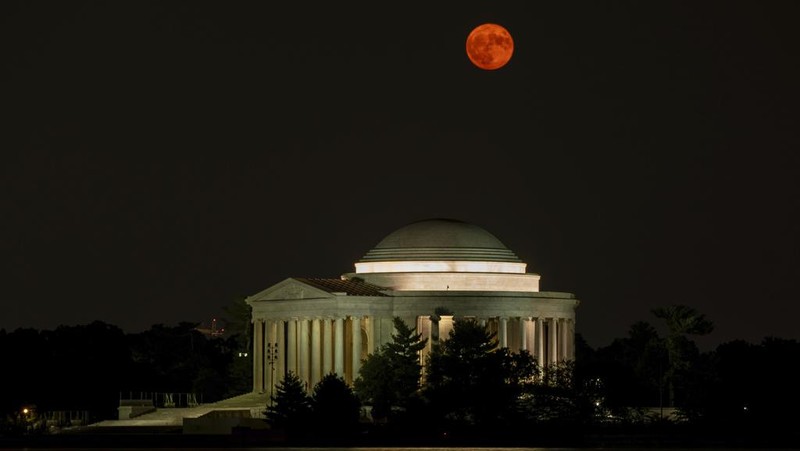 The supermoon rises above the Thomas Jefferson Memorial on the Tidal Basin in Washington, Tuesday, Aug. 1, 2023. (AP Photo/Carolyn Kaster)