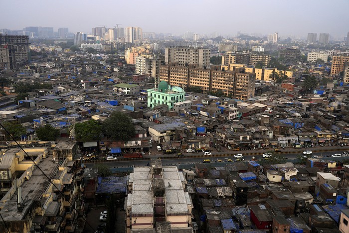 View of Dharavi slum in Mumbai, India, Thursday, March 16, 2023. The countrys population has more than quadrupled since its independence from colonial rule 76 years ago. For its women, about 50% of its population, the divide is palpable in the economy, where men overwhelmingly dominate. 39 million women are employed in Indias workforce compared to 361 million men, according to the Center for Monitoring the Indian Economy (CMIE). (AP Photo/Rajanish Kakade)