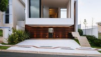 Rumah kotak ini juga bisa menjadi inspirasi rumah tanpa genteng. Rumah ini terlihat modern dan banyak ruang terbuka, sehingga memiliki sirkulasi udara yang baik. Foto: Rumah tanpa genteng/Homeedit 