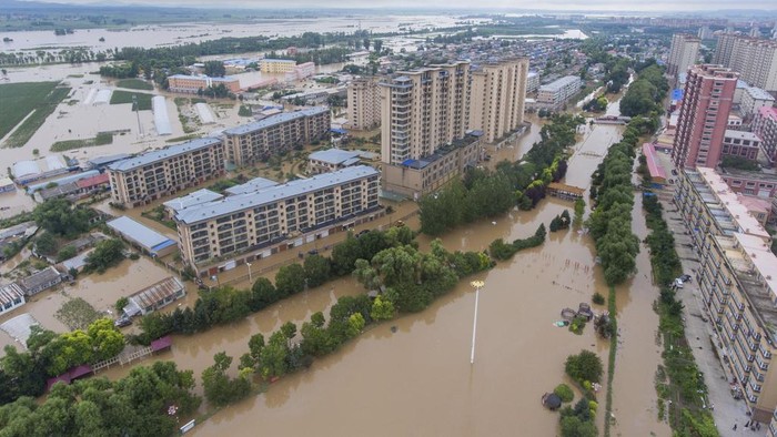 In this aerial photo released by Xinhua News Agency, flood waters cover Yanshou County of Harbin in northeastern Chinas Heilongjiang Province on Saturday, Aug. 5, 2023. Rain continued to pelt northeastern China in the wake of Typhoon Doksuri as authorities reported more fatalities and missing people while evacuating thousands more. (Gu Jingkun/Xinhua via AP)