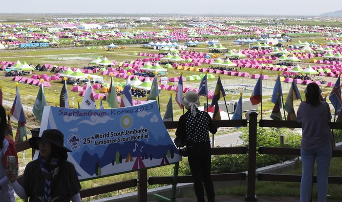 Tents are pitched at a scout camping site during the World Scout Jamboree in Buan, South Korea, Friday, Aug. 4, 2023. More than 100 people were treated for heat-related illnesses at the World Scout Jamboree being held in South Korea, which is having one of its hottest summers in years. (Choe Young-soo/Yonhap via AP)