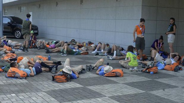 Attendees of the World Scout Jamboree rest in the shade at a scout camping site in Buan, South Korea, Friday, Aug. 4, 2023. More than 4,000 British Scouts will leave the World Scout Jamboree at a campsite in South Korea and move into hotels this weekend, the U.K. Scout Association said Friday, as concerns grow after more than 100 participants were treated for heat-related ailments. (Kim-yeol/Newsis via AP)