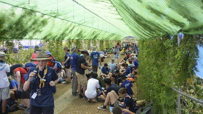 Attendees of the World Scout Jamboree rest in the shade at a scout camping site in Buan, South Korea, Friday, Aug. 4, 2023. More than 4,000 British Scouts will leave the World Scout Jamboree at a campsite in South Korea and move into hotels this weekend, the U.K. Scout Association said Friday, as concerns grow after more than 100 participants were treated for heat-related ailments. (Kim-yeol/Newsis via AP)