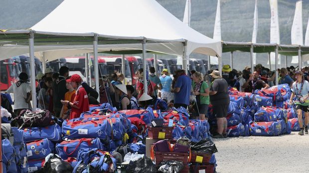 British scout members gather to leave the World Scout Jamboree campsite in Buan, South Korea, Saturday, Aug. 5, 2023. The world scouting body urged South Korea to cut short the World Scout Jamboree as thousands of British scouts began leaving the coastal campsite Saturday because of a punishing heat wave and American scouts talked of pulling out. (Kim Joo-hyung/Yonhap via AP)
