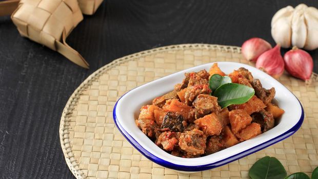 Sambal Goreng Hati Kentang or Hot Spicy Liver and Potatoes, Indonesian Traditional Cuisine, Typically Served During Eid Al Fitr Celebration with Ketupat.