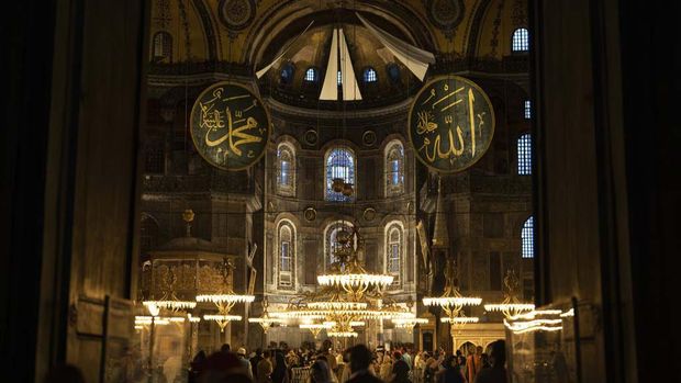 People visit the Byzantine-era Hagia Sophia mosque in Istanbul, Tuesday, Aug. 8, 2023. (AP Photo/Khalil Hamra)