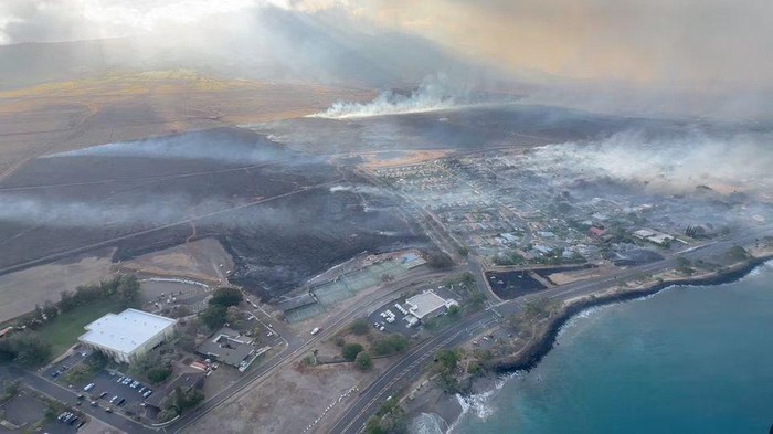 An aerial view as smoke rises from burnt areas amidst wildfires in Maui, Hawaii, U.S., August 9, 2023, in this screenshot taken from a social media video. Vince Carter/via REUTERS