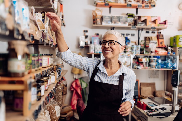 Senior woman working at supermarket