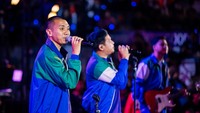 Penampilan RAN sedikit menurunkan tensi ketegangan setelah teriakan rally panjang pertandingan bulutangkis. Foto: BNI Media Clash 3.0
