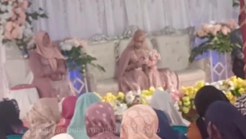 Tangkapan layar video viral seorang mempelai wanita sendirian dalam acara resepsi di Bima, NTB.