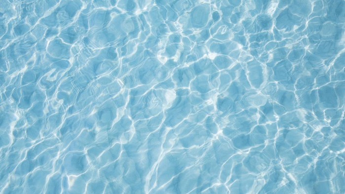 Blue sea surface with waves reflection aqua perspective background