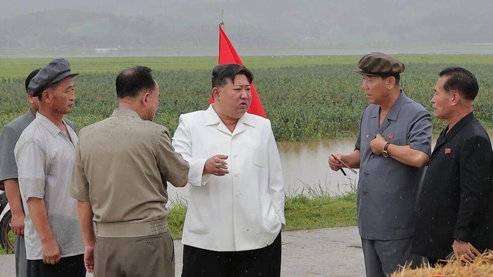 North Korean leader Kim Jong Un (centre) visited storm-hit areas and berated local officials over the damage, according to KCNA © STR / KCNA VIA KNS/AFP