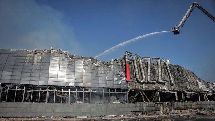 Rescuers work at a site of a shopping mall destroyed during a Russian military strike, amid Russia's attack on Ukraine, in Odesa, Ukraine August 14, 2023. REUTERS/Nina Liashonok