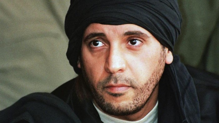 FILE - Hannibal Gadhafi, son of ousted Libyan leader Moammar Gadhafi, watches an elite military unit exercise in Zlitan, Libya, Sept. 25, 2011. Libya’s judicial authorities have formally asked Lebanon’s prosecutor general to help in the release of Hannibal Gadhafi, who was held in Lebanon since 2015 because of his deteriorating health conditions, judicial officials said Monday, Aug 14, 2023. (AP Photo/Abdel Magid al-Fergany, File)