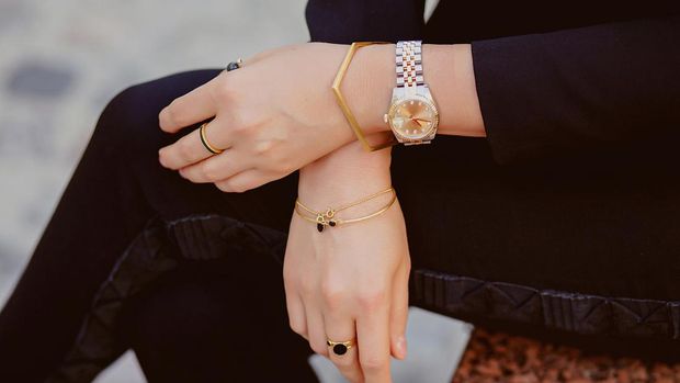 Beautiful jewelry, bracelets, watches, rings, female hands. Close-up