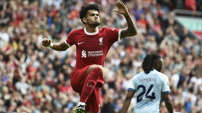 Liverpools Luis Diaz, left, celebrates after scoring his sides first goal during the Premier League soccer match between Liverpool and AFC Bournemouth at Anfield, in Liverpool, England, Saturday, Aug. 19, 2023. (AP Photo/Rui Vieira)